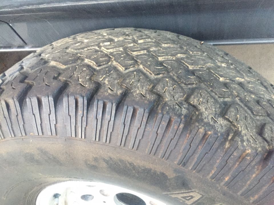 Tire tread on a vehicle part, with a Supermotors.net watermark