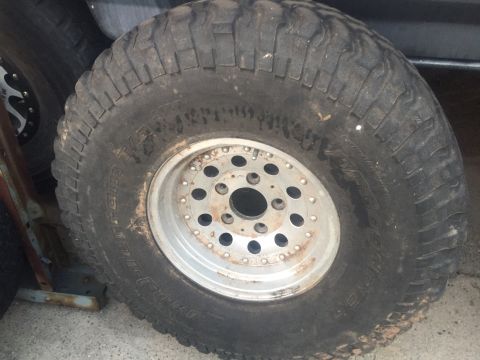 1986 Ford Bronco - This photo shows a single off-road tire and wheel, not a 1986 Ford Bronco.