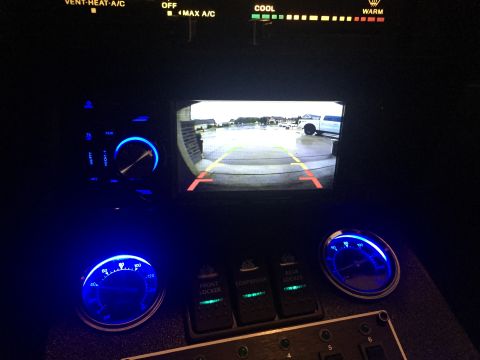 1988 Ford Bronco - Backup camera display shows two vehicles outside the interior of this vehicle.