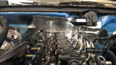 1995 Ford Bronco - Close-up view of an engine bay, showing insulation and fuel injectors, with a Supermotors.net watermark.