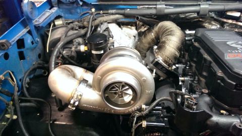 1995 Ford Bronco - Custom engine build a prominent turbocharger and exhaust system, likely a performance modification.