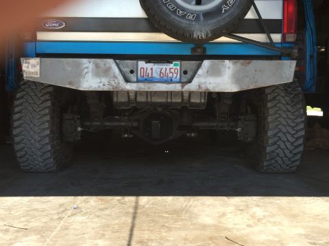 1995 Ford Bronco - The rear of a modified 1992 Ford Bronco shows off-road tires and a custom bumper.