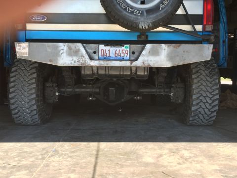 1995 Ford Bronco - Rear view of a 1995 Ford Bronco, a custom bumper and off-road tires.
