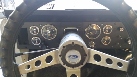 1979 Ford Bronco - The interior of a classic Ford Bronco shows a close-up of the dashboard and steering wheel. Multiple gauges are visible, including a speedo…