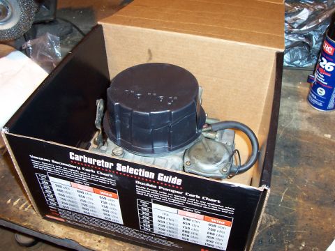 1994 Ford Bronco - A carburetor is shown inside its packaging, accompanied by a selection guide.