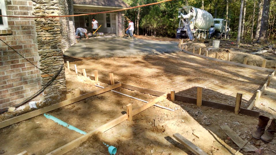 The first truck did about half the driveway.

The green pipes are for the gutter downspouts.
