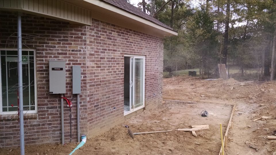 While concrete was being poured outside, the drywall was being sanded inside.  Sometimes it looked like the house was on fire.