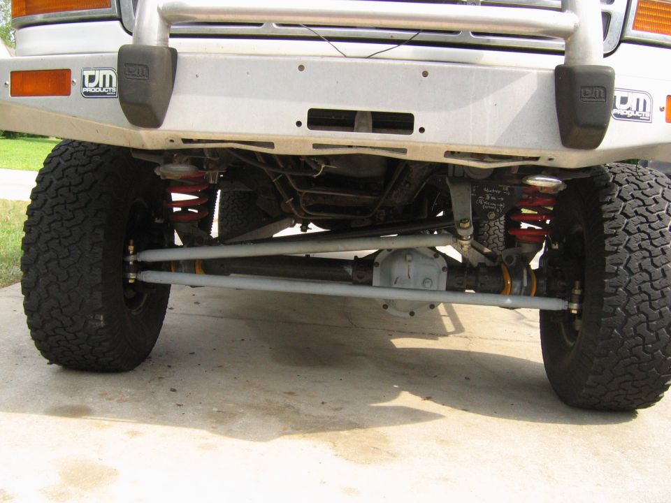 Front underside of a lifted 1992 Ford Bronco showing suspension and steering components.