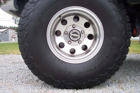 1995 Ford Bronco - Close-up of a BFGoodrich All-Terrain T/A tire and wheel assembly.