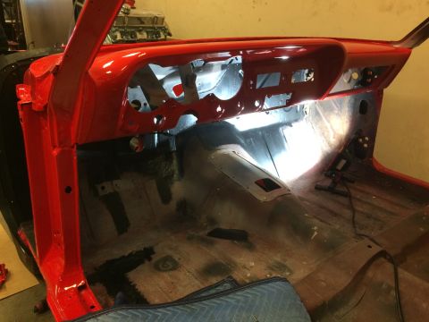 1964 Ford Fairlane - Interior of a 1964 Ford Fairlane undergoing restoration, with the dashboard painted red.