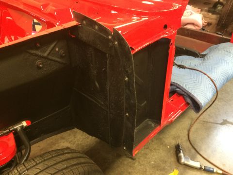 1964 Ford Fairlane - Car body section undergoing repair, showing inner fender well and surrounding structure.