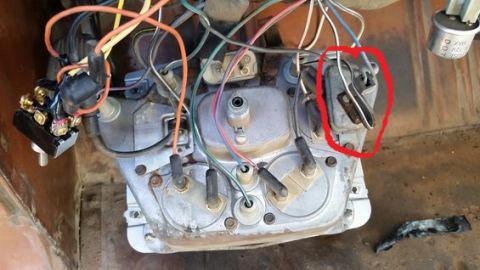 1973 Ford Bronco - This is a close-up, overhead view of the wiring harness and components behind a vehicle's dashboard, possibly from a 1973 Ford Bronco. A re…