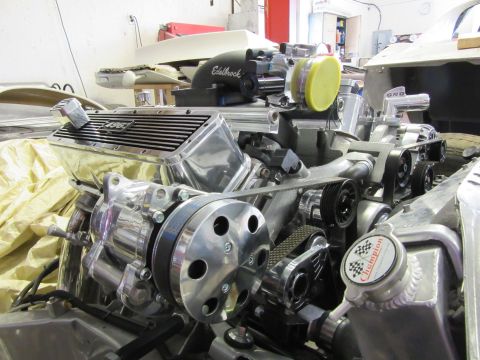 Polished chrome engine with Edelbrock intake and "496" emblem.