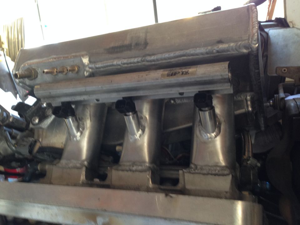 Aluminum intake manifold with fuel injectors and EIPTX fuel rail