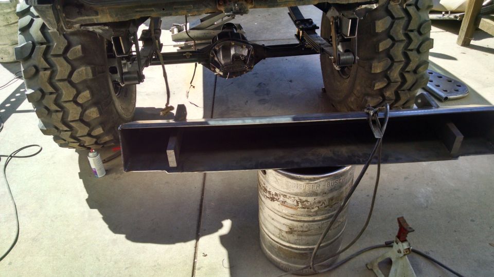 Rear axle, suspension, and custom bumper of a Jeep CJ7.