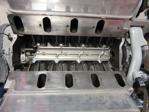 Internal view of a V8 engine showing pushrods and rocker arms.
