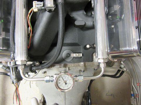 Close-up of engine fuel rail and pressure gauge