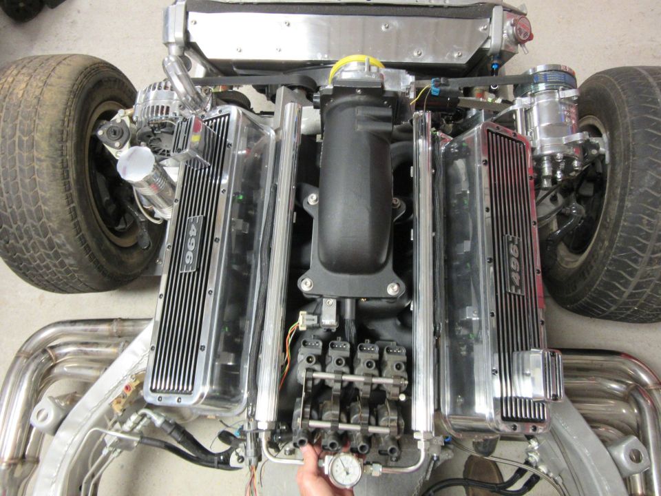 Overhead view of a custom 496 engine with chrome valve covers and stainless steel headers.