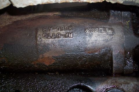 1973 Ford F-250 - A close-up view of a cast iron engine block with stamped serial numbers. The numbers visible are RF-D7TC 3550-AB and 1-282.