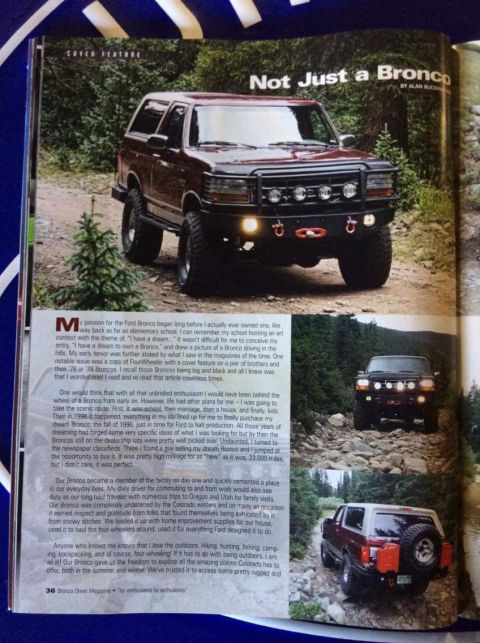 1996 Ford Bronco - A maroon 1996 Ford Bronco is shown from a front 3/4 angle on a dirt road with trees in the background. The Bronco has a black aftermarket b…