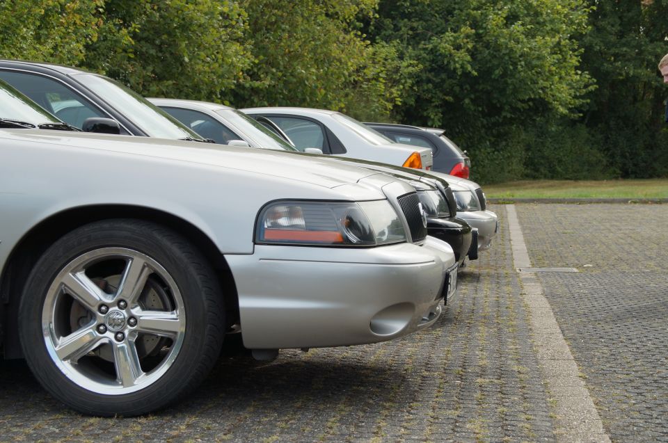 Front quarter view of a silver 2003 Mercury Marauder parked in a lot with other cars behind it