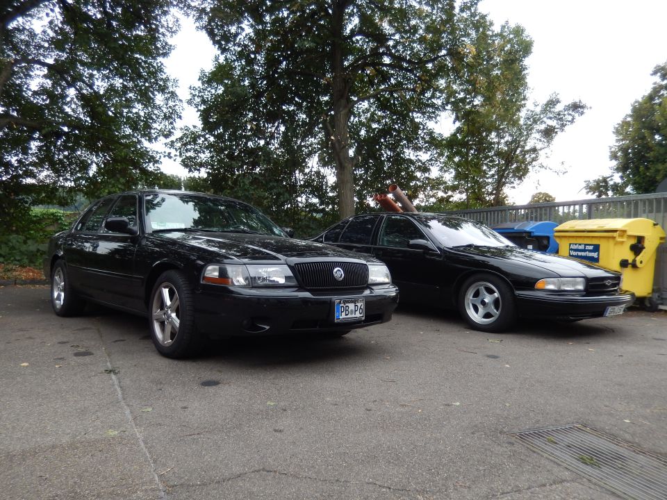 2003 Mercury Marauder and another black sedan parked outdoors
