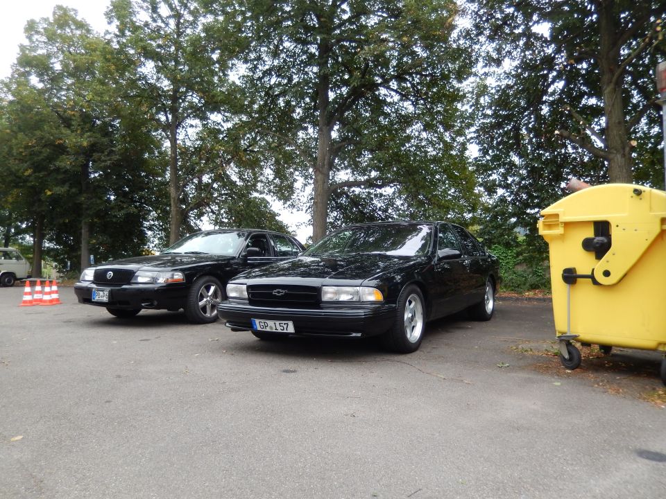 Black Mercury Marauder and Chevrolet Caprice parked side-by-side