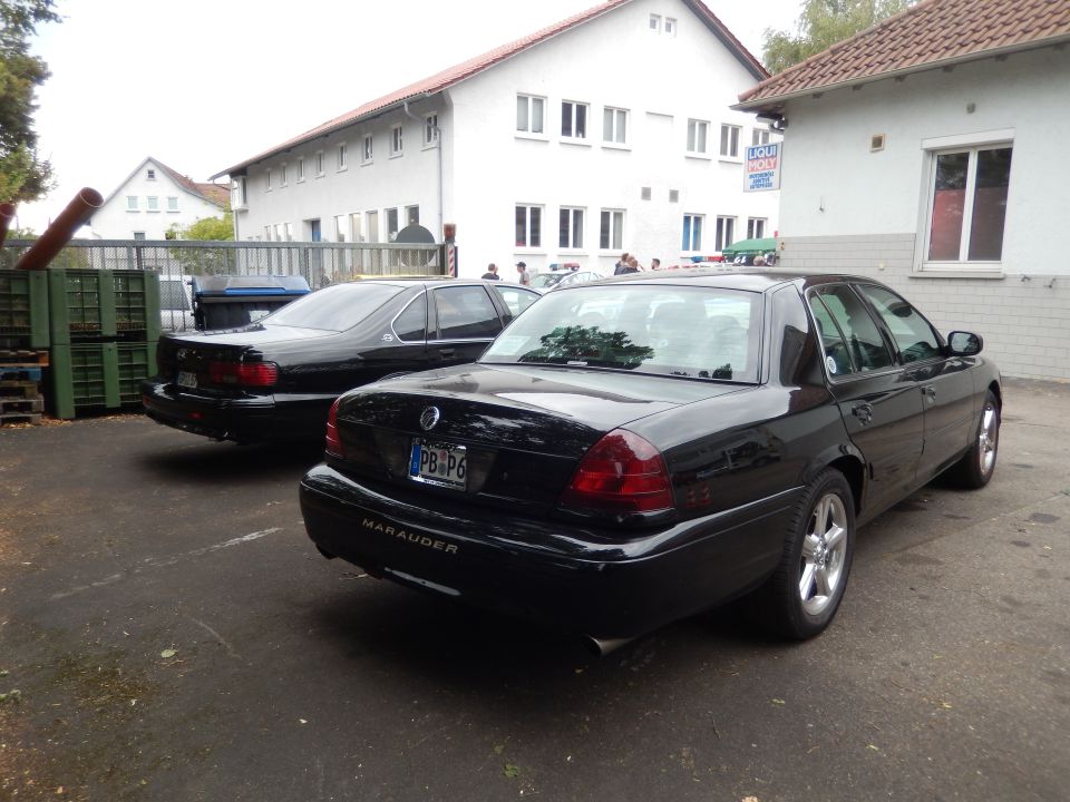 2003 Mercury Marauder rear view, parked next to another black sedan
