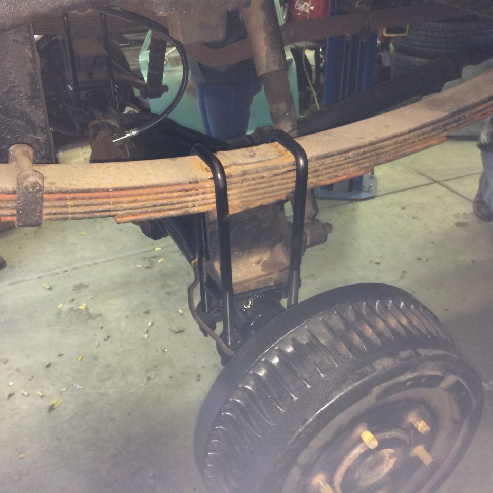 close-up of leaf springs and rear axle on a vehicle