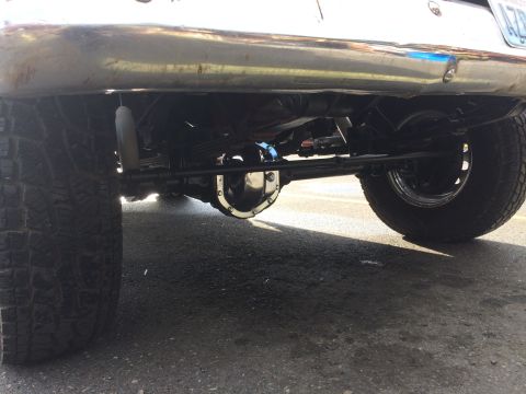 1962 Chevrolet Suburban - Underside view of a vehicle's rear axle, differential, and suspension system.