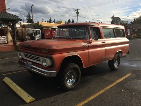 1962 Chevrolet Suburban - This 1962 Chevrolet Suburban displays its classic body style and is parked in a lot.