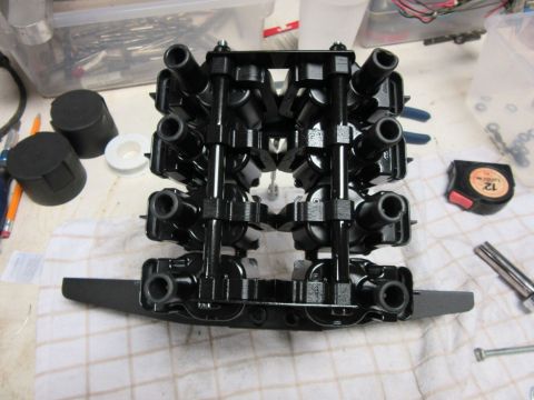 engine ignition coil pack on a table with tools