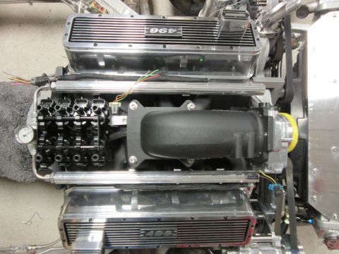 Engine with "965" and "496" on valve covers, fuel injectors visible