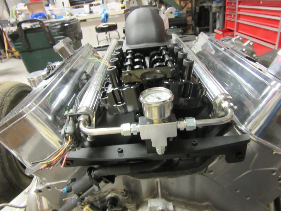 Engine with chrome valve covers and a pressure gauge