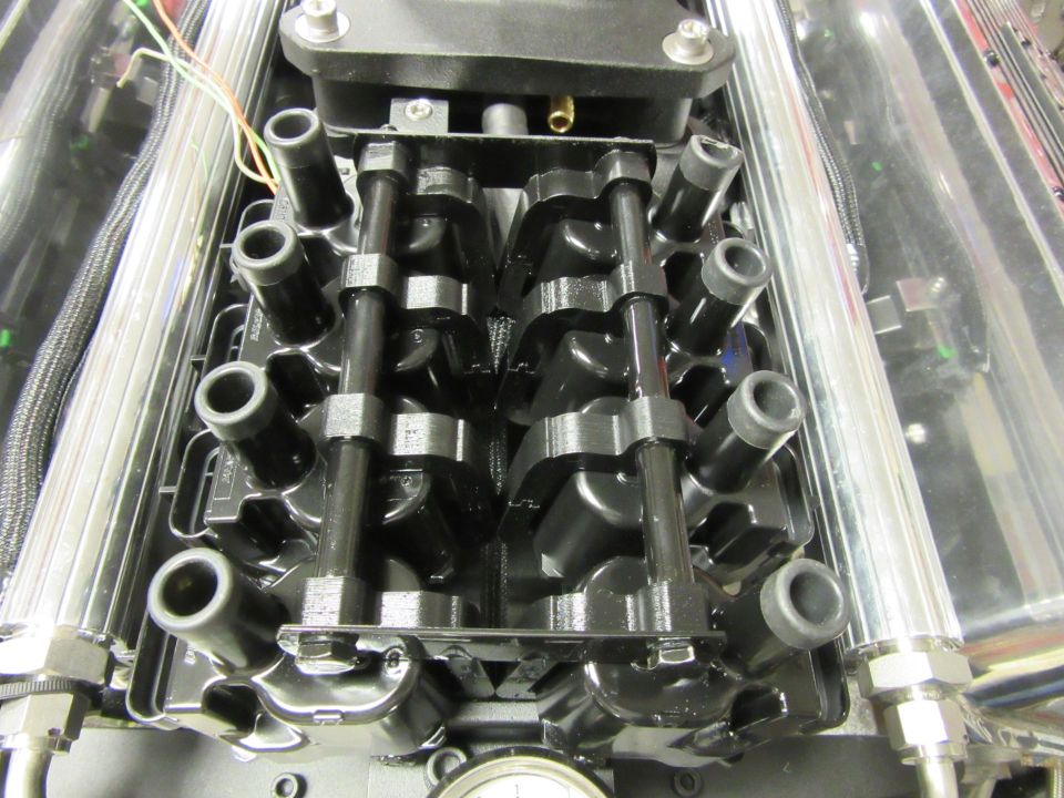 Engine close-up with spark plug wires and intake manifold
