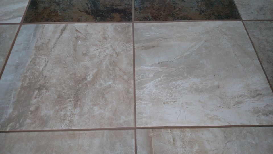 Tiled floor with beige and dark brown tiles