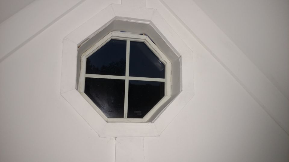 Octagon window on a white building