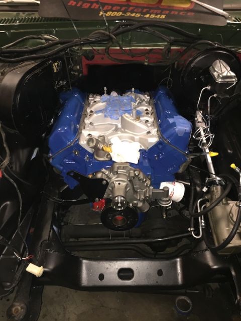 1978 Ford Bronco - The engine bay shows a recently installed V8 engine with blue valve covers and intake manifold.
