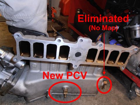 1990 Ford Bronco - Close-up of an engine intake manifold with modifications indicated by text and circles.