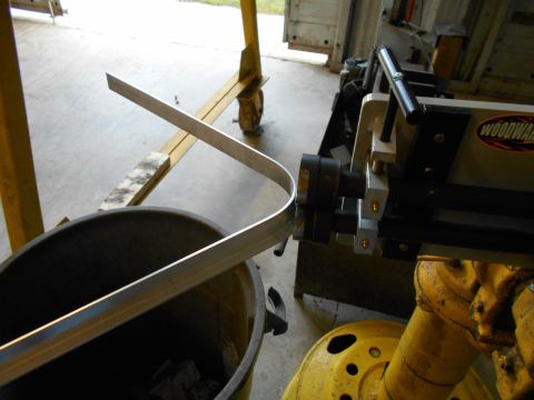 1992 Ford Bronco - Aluminum stock is being bent using a Woodward metal roller and a bucket.
