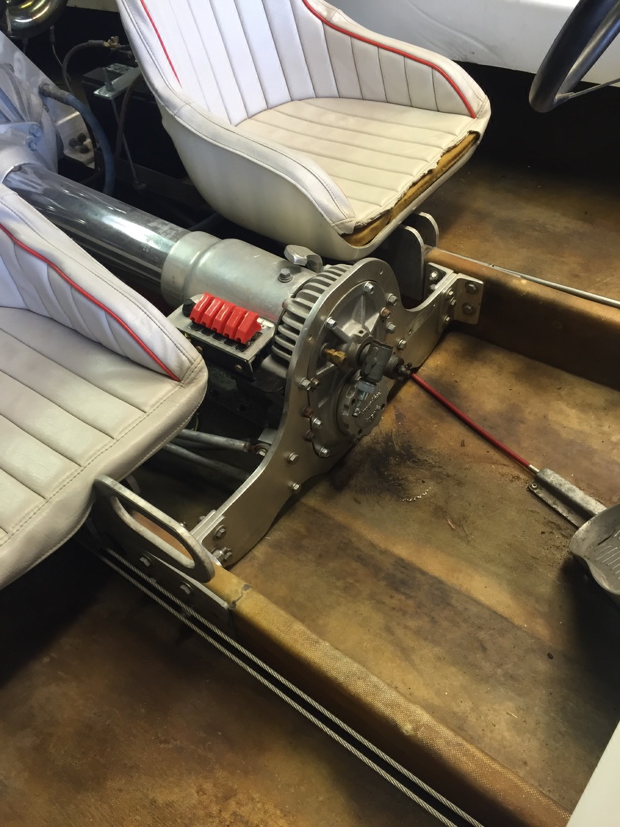 Boat interior showing seats, transmission, and drive shaft