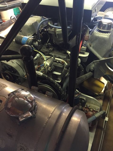 1970 Ford Five Hundred - Close-up view of a vehicle's engine and a large cylindrical fuel tank.