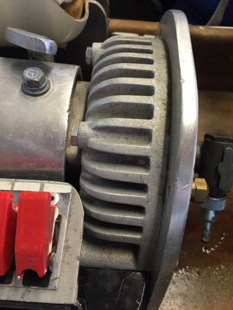 1970 Ford Five Hundred - Close-up of a finned engine component with red electrical switches visible.