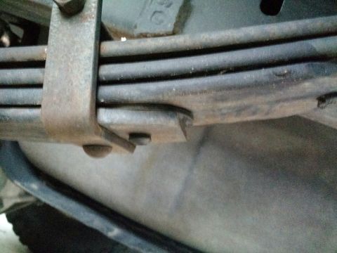 1992 Ford Bronco - This photo shows the underside of a vehicle, focusing on the rear leaf spring assembly.