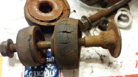 1976 Ford Ranchero - This close-up shot shows a heavily rusted metal part, likely a component from a vehicle's mechanical system.