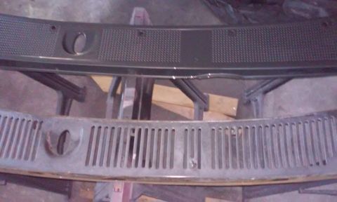 1986 Ford Bronco - Two dark-colored vehicle cowl grilles are shown, one above the other. The top grille has a textured surface and a circular cutout, while th…