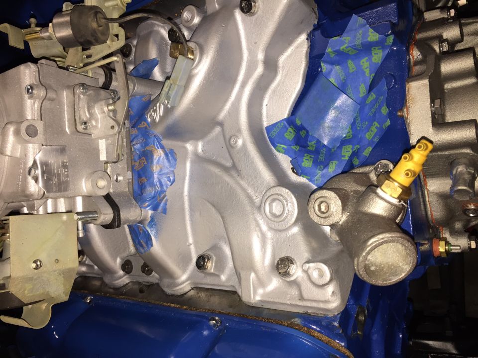 Engine intake manifold with blue tape and yellow temperature sensor