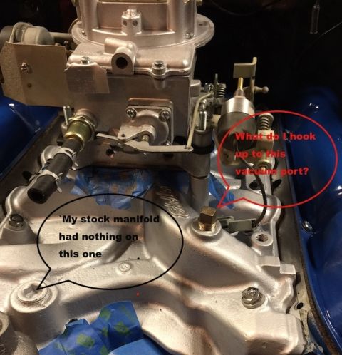 1978 Ford Bronco - A close-up view of a V8 engine's intake manifold and carburetor, with handwritten annotations pointing to vacuum ports.