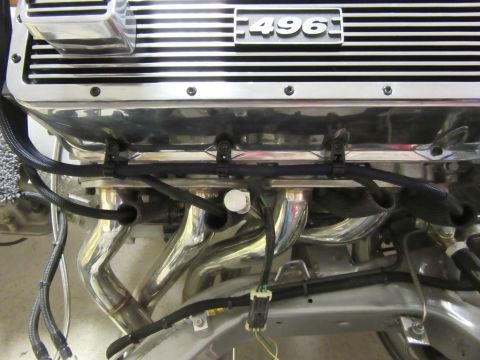 Chrome engine with 496 valve cover and exhaust headers