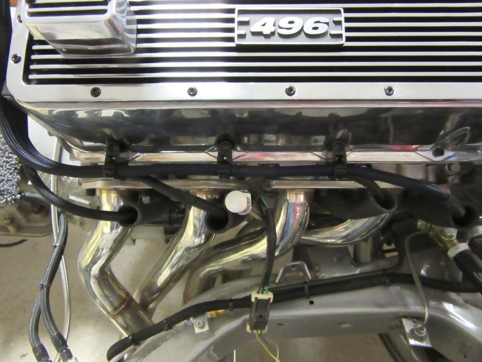 Chrome engine with 496 valve cover and exhaust headers